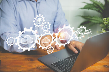 Businessman touching on cloud computing with business icons. Technology cloud computing for uploading or downloading internet network and communication wireless. Business, Technology concept.