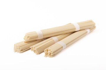 Dried raw rice noodles isolated on white background.