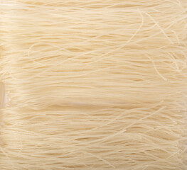 Dried raw rice noodles isolated on white background.