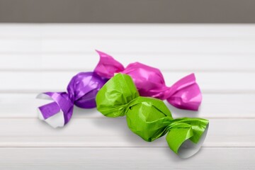 Wrapped tasty sweet Candy on a desk