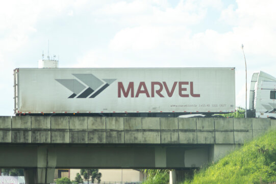 Sa&otilde; paulo-sp,brasil-February 22,2023 Truck passing on a highway and in the bodyshop is written "marvel"