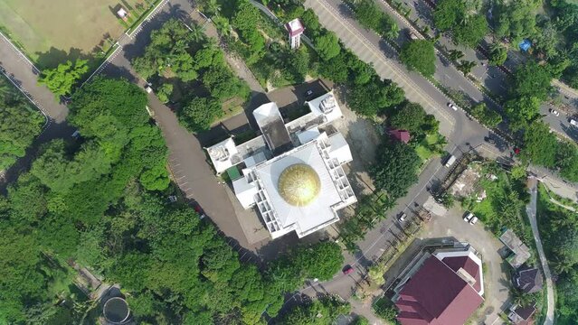 4K footage aerial view of the Baitul Faidzin Grand Mosque at noon in the middle of the central government administration.