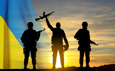 Fototapeta na wymiar Silhouettes of soldiers with Ukraine flag against the sunset. Armed forces of Ukraine concept. EPS10 vector