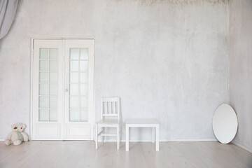 one chair with toy with mirror in a bright room interior furniture