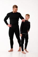 Father and son in thermal underwear on a white background