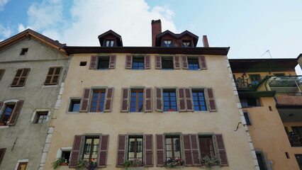 Obraz premium Exterior establishing shot of building in Europe. Outdoor windows facade. Traditional architecture