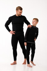 Father and son in thermal underwear on a white background