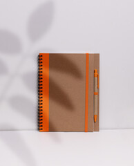 Ring-bound notebook made of recycled material on a white background
