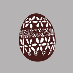 Hand drawn Easter egg with white lines on a brown background. Ethnic traditional motif ukrainian national pattern swirls
