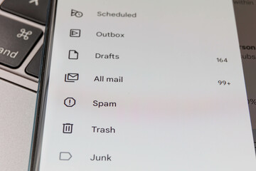 Spam in email inbox. Email inbox on smartphone - junk, trash, spam
