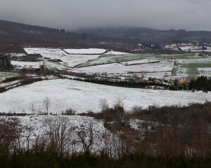 View from above of a snowy field in a French town