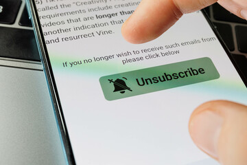 Unsubscribe button on smartphone. Unsubscribe of newsletters