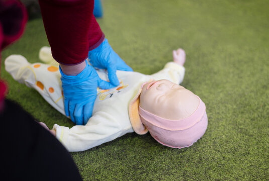 CPR training on an infant training manikin