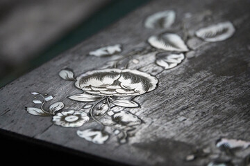 Close-up of an antique mother-of-pearl inlaid jewelry box.