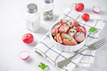 Roasted spiced radish with parsley in a bowl