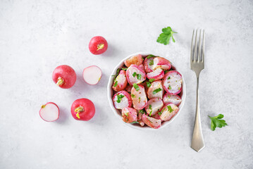 Roasted spiced radish with parsley in a bowl