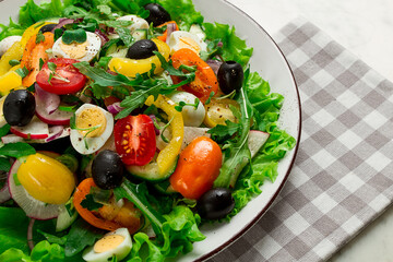 Vegetable salad , with quail eggs and olives, fresh, close-up, no people,