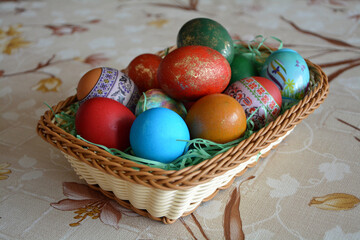 Closeup of a weave basket with multicolored dyed eggs for the traditional Easter celebration in Bulgaria