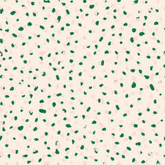 Modern drops form a seamless pattern. Pink pastel background with chaotically scattered green spots for fabrics, textiles. Vector.