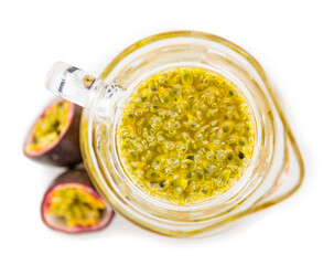 Maracuja Juice isolated on white background (selective focus; close-up shot)