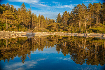 Reflective lake scape  with beautiful golden hour sun