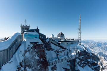 the top of germany aerial view of the snow-covered mountains photographed in winter with bright sunshine and not a single cloud in the sky a place worth seeing in the south of germany