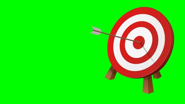 Perfect shot right in the center of the circular red and white target on a wooden tripod of an arrow on a green background
