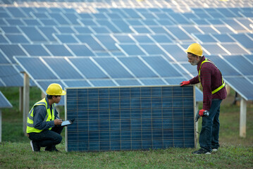 Workers checking solar panels at Cholapham station  solar power station