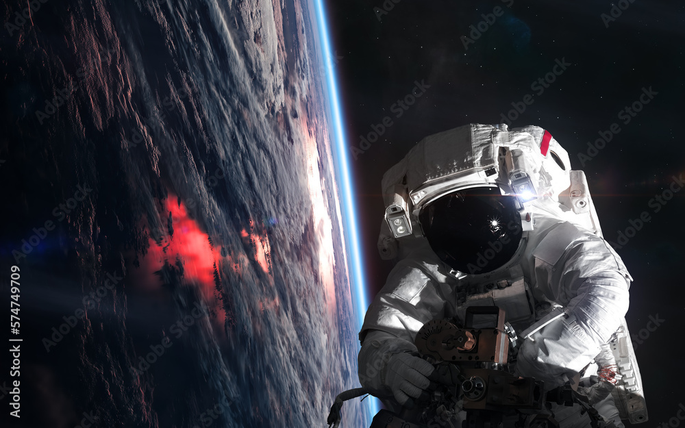 Canvas Prints astronaut in outer space orbiting planet earth. solar system. science fiction. elements of this imag