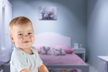 Naklejka premium Cute small baby have fun on bed