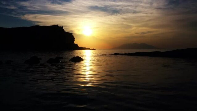 Gokceada, Imbros Island sunset view with mountains sea waves and the opposite island of Samothrace. Arcadia Kardamos district. 4K motion