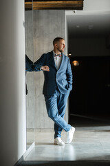 portrait of smiling groom with beard