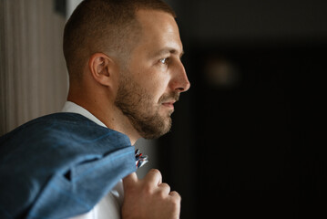 portrait of smiling groom with beard