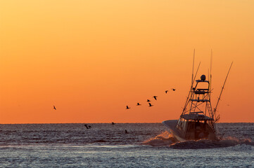 Fishermen heading out at sunrise; Virginia Beach, Virginia