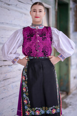 Young beautiful slovak woman in traditional costume. Slovak folklore