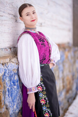 Young beautiful slovak woman in traditional costume. Slovak folklore