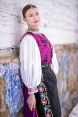 Young beautiful slovak woman in traditional costume. Slovak folklore