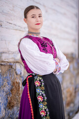 Young beautiful slovak woman in traditional costume. Slovak folklore