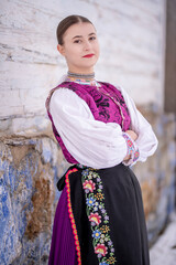 Young beautiful slovak woman in traditional costume. Slovak folklore