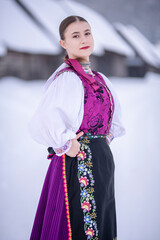 Young beautiful slovak woman in traditional costume. Slovak folklore