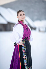 Young beautiful slovak woman in traditional costume. Slovak folklore