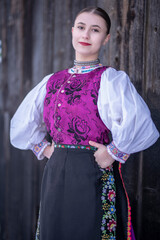 Young beautiful slovak woman in traditional costume. Slovak folklore