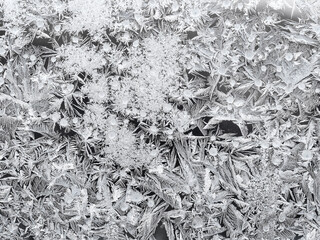 frozen window glass closeup on cold winter day