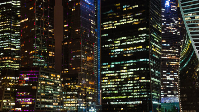 panoramic urban background with of illuminated towers in Moscow city business district in night