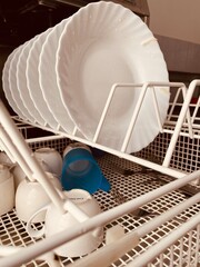 lunch plates stacked in the dishwasher