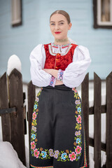 Young beautiful slovak woman in traditional costume. Slovak folklore