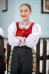 Young beautiful slovak woman in traditional costume. Slovak folklore