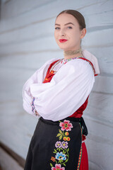 Young beautiful slovak woman in traditional costume. Slovak folklore
