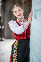 Young beautiful slovak woman in traditional costume. Slovak folklore