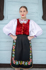 Young beautiful slovak woman in traditional costume. Slovak folklore